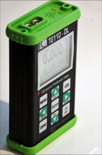 Load image into Gallery viewer, Nova TG110-DL General Purpose Ultrasonic Thickness Gauge in aluminium casing with green rubber end caps for additional protection - Advanced NDT Limited