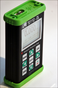 Nova TG110-DL General Purpose Ultrasonic Thickness Gauge in aluminium casing with green rubber end caps for additional protection - Advanced NDT Limited